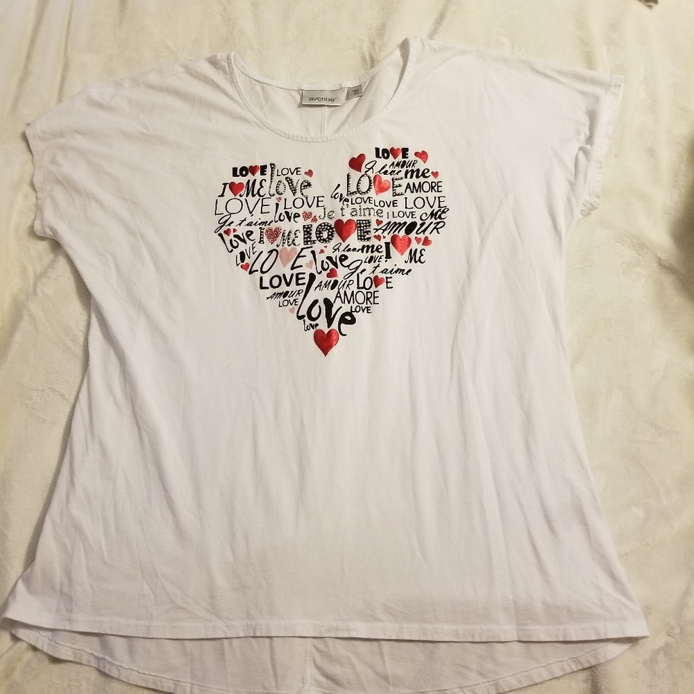 A white short sleeve shirt with heart graphic